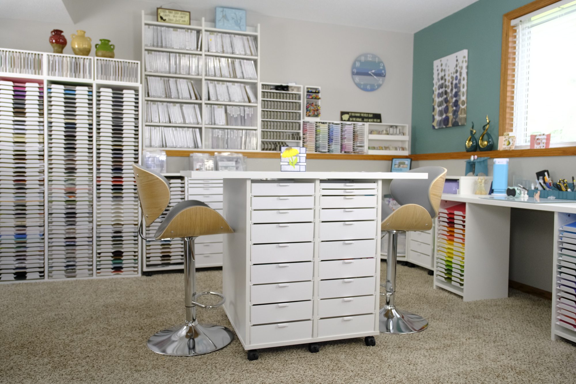 Best Craft Organizer craft room with counter-height desk and storage cabinets